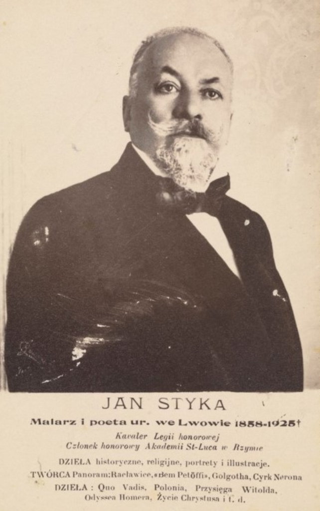 zdjęcie brodatego mężczyzny w garniturze z muszką