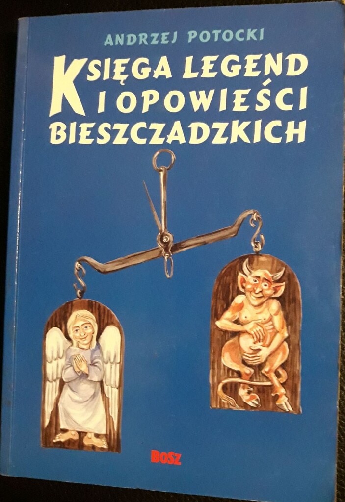 Okładka książki Księga legend i opowieści bieszczadzkich, na niej na wiszącej wadze obrazki anioła i diabła.