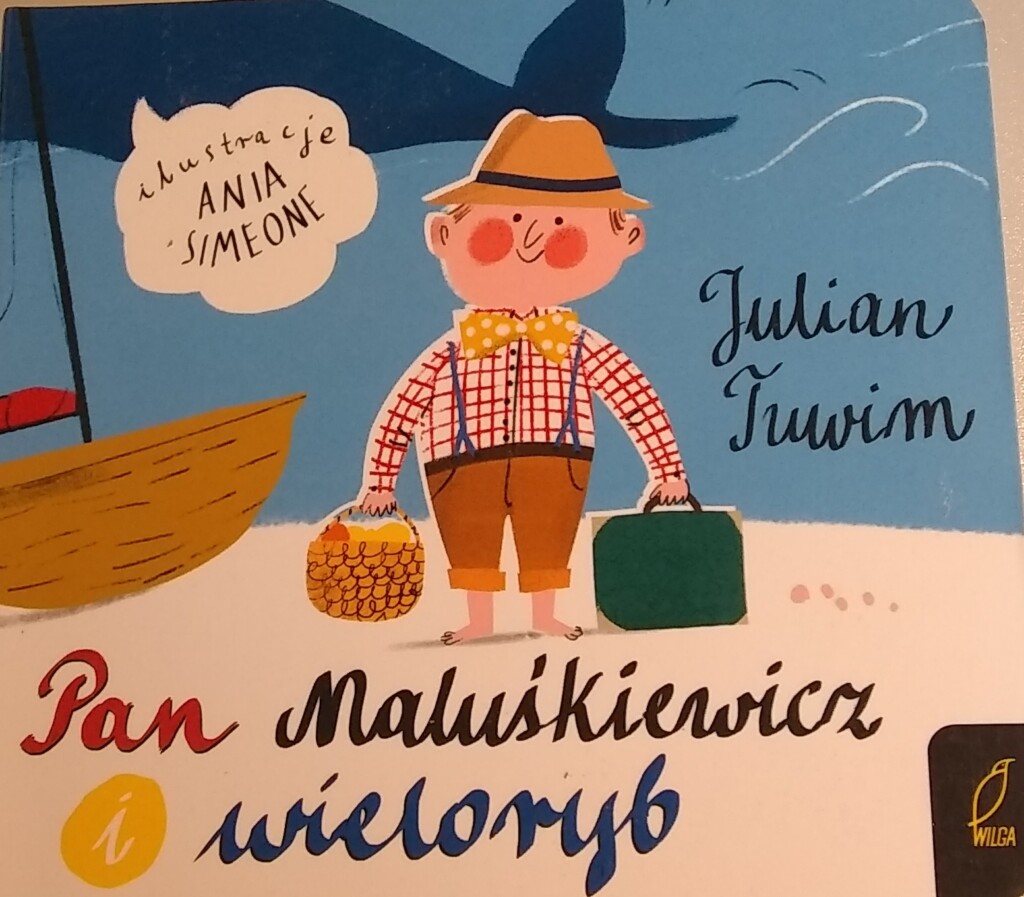 Rysunkowa okładka książki Pan Maluśkiewicz i wieloryb, na niej mężczyzna w kapeluszy z koszem piknikowym i walizką.